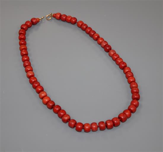 A single strand coral bead necklace, with gilt metal clasp, 47cm, gross weight 64 grams.